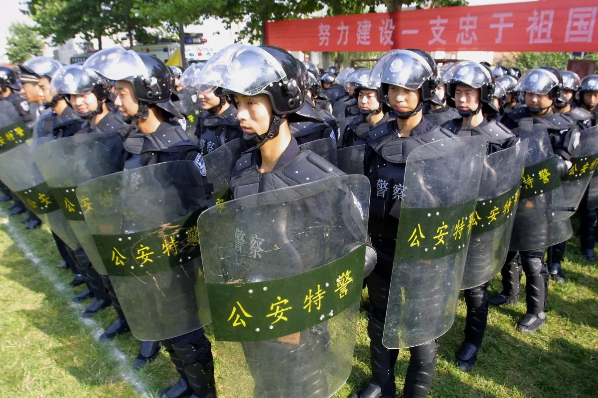 Chinese riot police show off their skills at a demonstration in Xian, central China's Shaanxi province 13 July 2005. (STR/AFP/Getty Images)