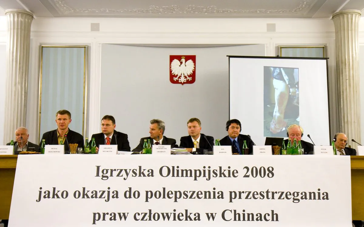 DETERMINED: World Solidarity representative Michal Orzechowski (second from left) presents an appeal to Polish leaders to boycott the Beijing 2008 Olympics at a human rights conference in the Polish Parliament, on October 9, 2007. (Conrado E. Maul, Special to the Epoch Times)