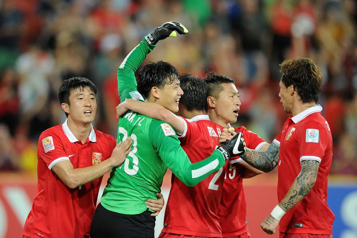 Chinese soccer players celebrate winning the 2015 Asian Cup match between Saudi Arabia and China PR at Suncorp Stadium in Brisbane, Australia, on Jan. 10, 2015. (Matt Roberts/Getty Images)