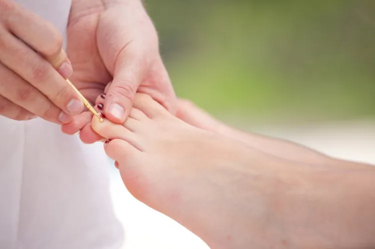 Chinese medicine considers it essential for the body to maintain a balance of yin and yang. It views the upper body as yang and the lower body as yin, connected by meridians. Based on this principle, one method of relieving neck and shoulder pain is to apply treatment to the feet (Wolfgang Amri/Photos.com).