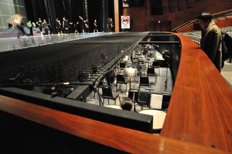 The safety net at the Southern Alberta Jubilee Auditorium covers 2/3 of the orchestra pit. Calgary Shen Yun show organizers say the net and its support beams block the conductor’s vision, making vital cues and communication with the performers nearly impossible. (Courtesy Falun Dafa Association of Calgary)