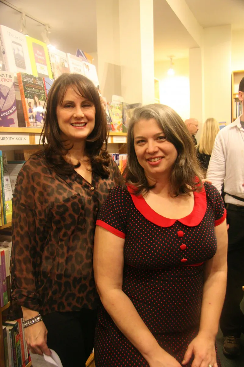 Lisa Caron (L) and Lisa Doran host a book launch for their second book, “Joyful Birth: More Childbirth Stories Told by Doulas,” at the Parentbooks bookstore in Toronto on Nov. 28, 2012. (Kristina Skorbach/The Epoch Times)