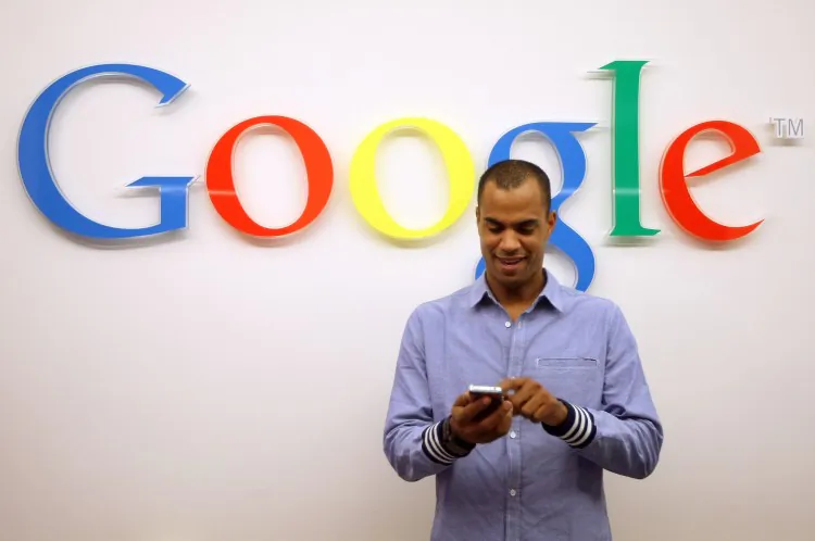 A visitor stands in front of the Google office in Berlin, Germany. The FTC announced that it was ending an anti-trust investigation into Google, and would mostly leave the search giant alone, though it wrested some promises from the Mountain View company. (Adam Berry/Getty Images)