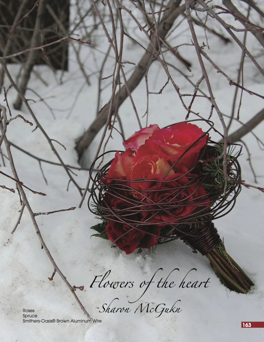 Winter bouquet of roses and spruce encircled in decorative wire.  (Douglas McGukin/”Flowers of the Heart”)