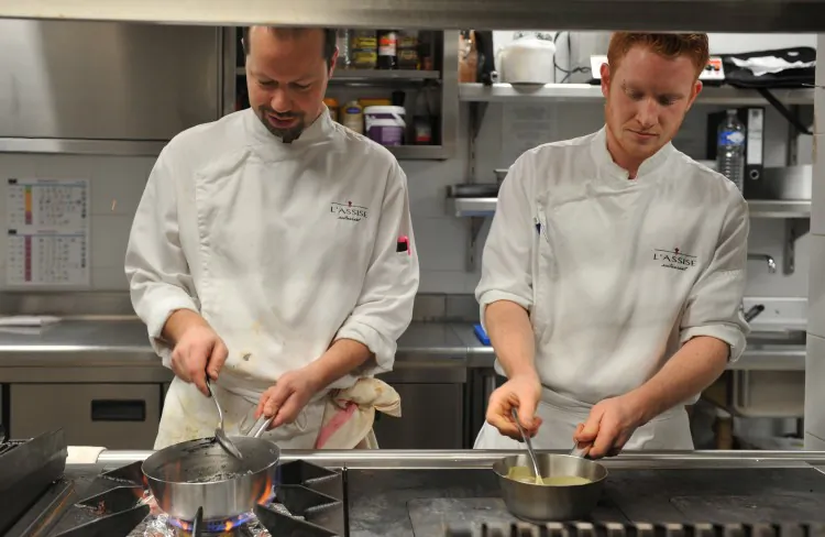 Cooks work at the Hotel Radisson Blu in Feb. 8 in Nantes, western France. (Frank Perry/AFP/Getty Images)
