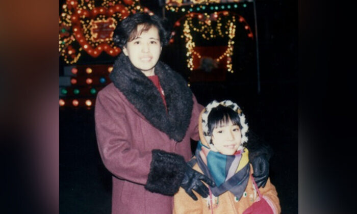 Amy Yu and her mother. The background is the Chinese character “love”. This is the only picture that remains after the police took all the family's belongings (Amy Yu)