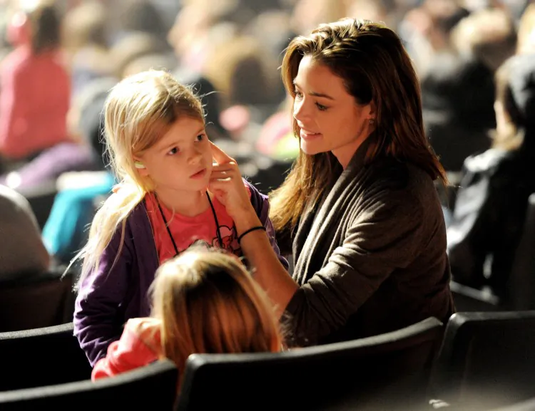 Actress Denise Richards (R), with daughter Lola (C), puts earplugs in her daughter Sam’s ears at the “Concert for Hope” presented by Staples on March 20, 2011, in Universal City, Calif. Adequate hearing protection will help to prevent or limit the damage to our hearing that loud noise creates. (Kevin Winter/Getty Images)