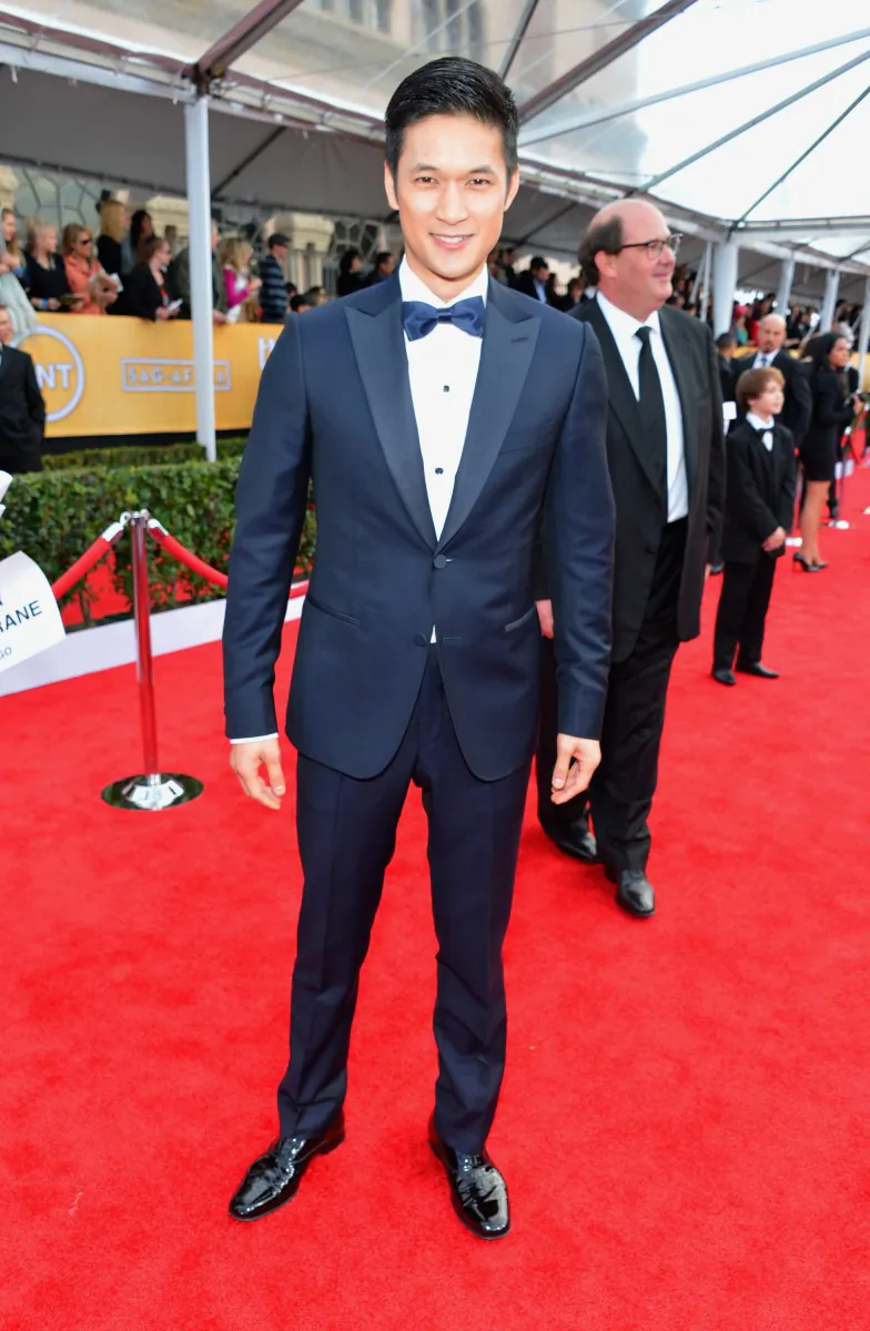 Mark Salling wore a three-piece Z Zegna navy suit and a matching tie that was held in place by a tie-bar. (Alberto E. Rodriguez/Getty Images)"][/caption] [caption id="attachment_347777" align="alignleft" width="826" caption="Damian Lewis looked dapper in a navy Burberry tux that complemented Helen McCrory’s yellow confection. (FRAZER HARRISON/GETTY IMAGES)"][/caption] [caption id="attachment_347776" align="alignleft" width="784" caption="Harry Shum Jr. donned a Z Zegna double-button-closure tuxedo in navy. His shirt buttons matched his blue bow tie.(Alberto E. Rodriguez/Getty Images)