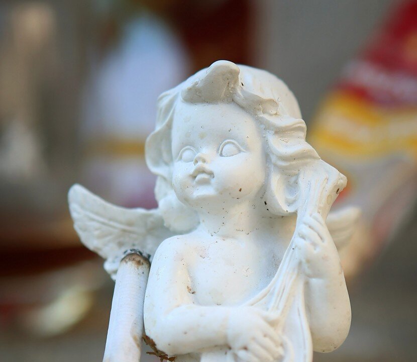 An angel and a cigarette. Studies show that hope and the belief in success help motivate smokers to quit. (Scott Olson/Getty Images)