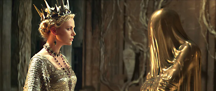 Academy Award-winning actress Charlize Theron consults with the Mirror Man in the action-adventure “Snow White and the Huntsman.” (The Mill/ Universal Pictures)