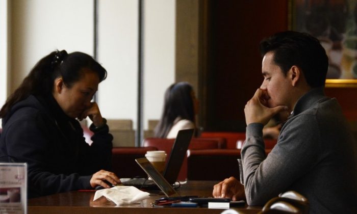 People in Beijing use their laptops at a cafe in Beijing in November, 2012. (Wang Zhao/AFP/Getty Images)