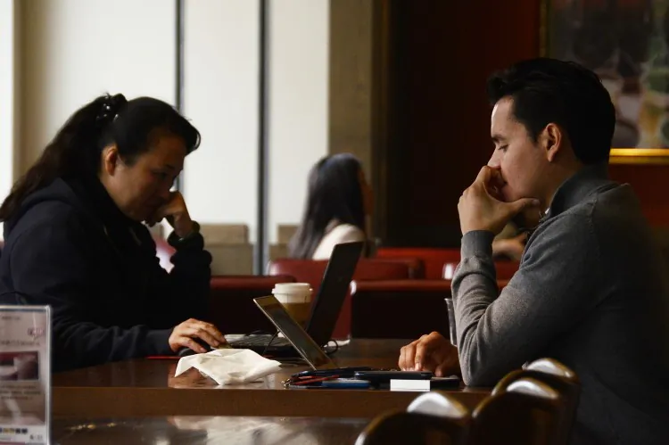 People in Beijing use their laptops at a cafe in Beijing in November, 2012. (Wang Zhao/AFP/Getty Images)