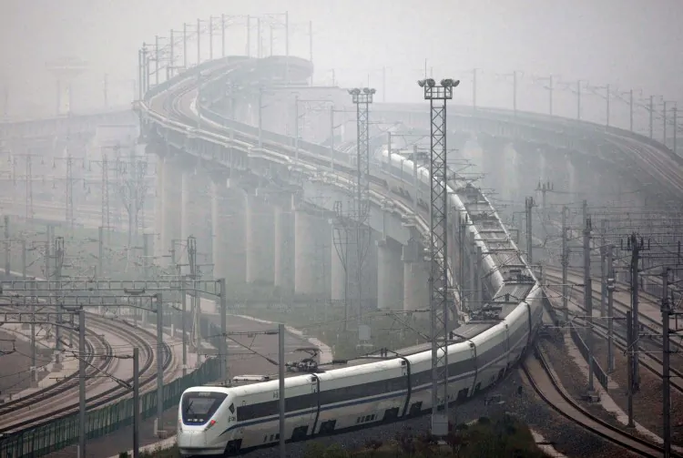 A high-speed train leaves Shanghai Hongqiao Railway Station during its test run in 2011 in Shanghai. The massive investment in high-speed rail hasn't paid off in China, and recently the Ministry of Railways again raised its shipping prices to help service the enormous debt. (ChinaFotoPress/Getty Images)