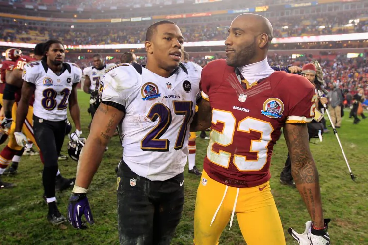 DeAngelo Hall #23 talks with Ray Rice #27 on Dec. 9, 2012 in Landover, Maryland. (Rob Carr/Getty Images)