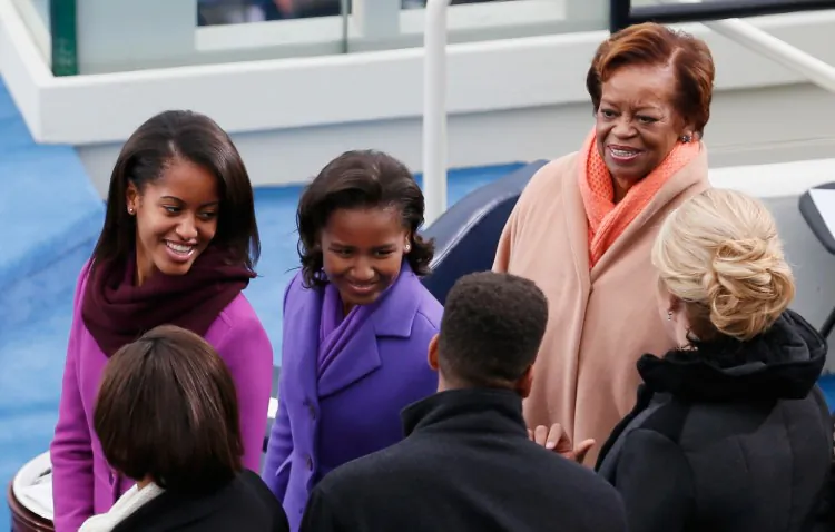 Sasha Obama (L) and Malia Obama (C) and mother-in-law Marian Robinson look on following the president's public ceremonial inauguration on the West Front of the U.S. Capitol Jan. 21, 2013 in Washington, DC. (Rob Carr/Getty Images)