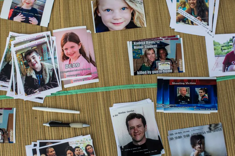Postcards meant to be mailed to members of Congress are displayed at a rally on the National Mall on Jan. 26, 2013 in Washington, DC. They includes survivors of the shooting at Virginia Tech, Newtown, Connecticut, and others. (Brendan Hoffman/Getty Images)