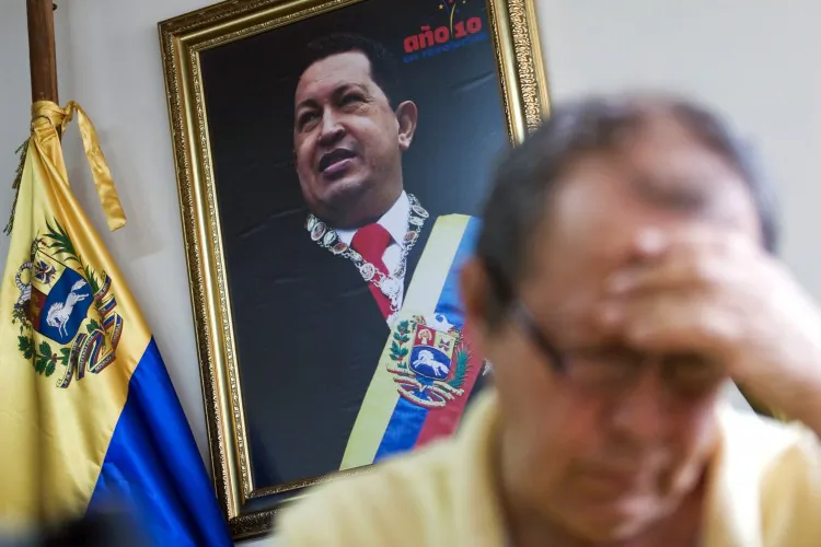 A sympathizer of late Venezuelan President Hugo Chavez signs a condolence book at the Venezuelan consulate in Medellin, Antioquia department, Colombia on March 7, 2013. (Fredy Amariles/AFP/Getty Images)