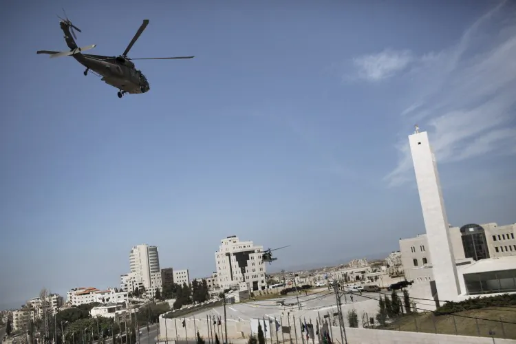A U.S. black hawk helicopter carrying a delegation traveling with U.S. President Barack Obama prepares to land on March 21, 2013, at the Muqata, the Palestinian Authority headquarters in the West Bank city of Ramallah. Obama arrived in the West Bank city of Ramallah on his first visit as president. (Marco Longari/AFP/Getty Images)
