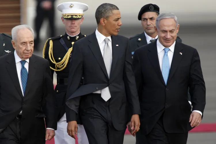 Israeli President Shimon Peres (L), U.S. President Barack Obama (C), and Israeli Prime Minister Benjamin Netanyahu (R) walk together prior to Obama departing from Ben Gurion International Airport on March 23, 2013 in Lod, Israel. Obama concluded his first visit to Israel and West Bank. (Lior Mizrahi/Getty Images)