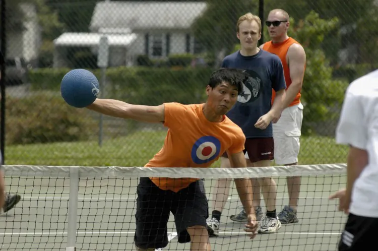 A man takes aim at an opponent during a game of 'Dodgeball' at a tennis court. (Micah Walter/Getty Images)