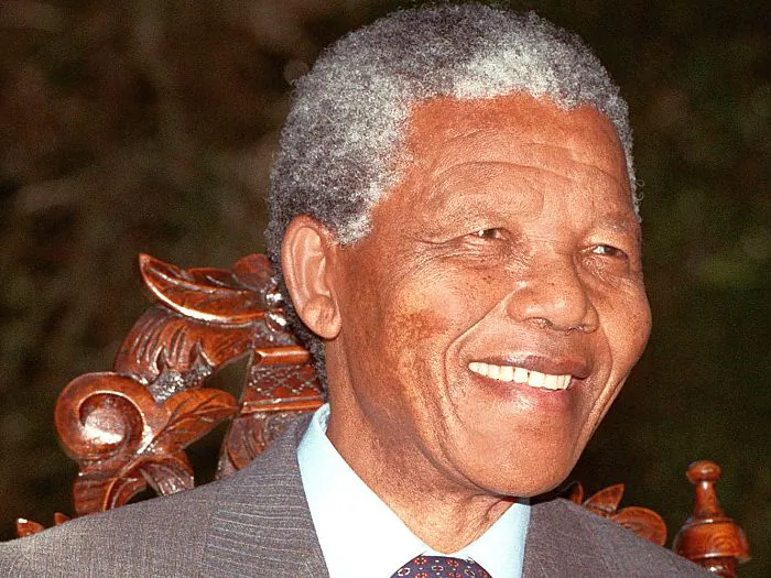African National Congress President Nelson Mandela shown in a file photo dated Feb. 12, 1990 posing for photographers during a photo session after his first press conference in Cape Town following his release from prison. After his arrest in 1962, a group of activists from London strove to fight apartheid in South Africa. (Walter Dhladhla/AFP/Getty Images)
