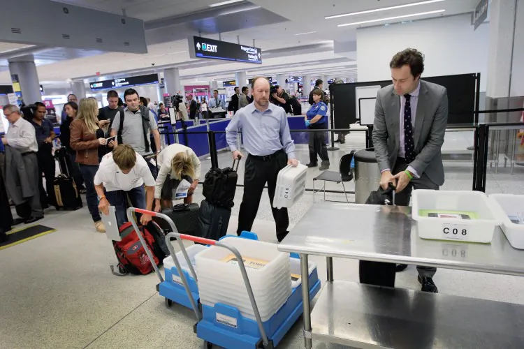 Passengers wait to clear security at Miami International Airport in 2011 in Miami, Florida. Long Lines at airport security are already common could a weigh in station make them longer? (Joe Raedle/Getty Images)