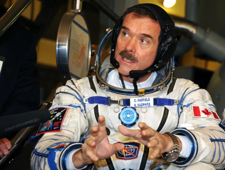 Canadian astronaut Chris Hadfield has become something of a sensation by sharing his experiences in space on social media sites. (Alexander Nemenov/AFP/Getty Images)