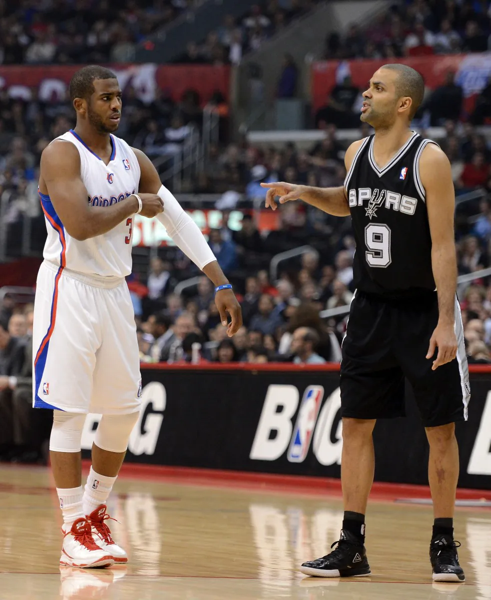 Chris Paul (L) and Tony Parker (R) have their respective teams, the Clippers and the Spurs, at the top of the Western Conference. (Harry How/Getty Images)