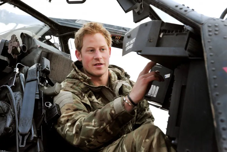 A file photo of Prince Harry, or Captain Wales, as he is known in the British Army, making his early morning pre-flight checks on the flight-line, at Camp Bastion southern Afghanistan, where he served as an Apache Helicopter Pilot/Gunner with 662 Squad Army Air Corps, from September 2012 until January 2013. (John Stillwell/PA Wire Press Association)