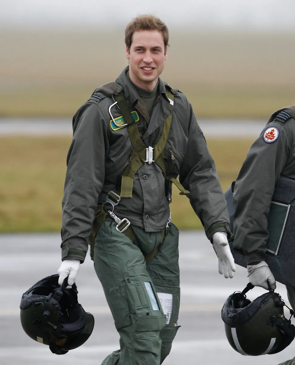 Prince William walks across the tarmac on his way to fly a Grob 115E light aircraft, at airbase RAF Cranwell, near Sleaford, Lincolnshire on Jan. 17 2008. Prince William and other military personnel that work in search and rescue may be replaced by contract workers as an American company has taken the contract over from the British military. (Adrian Dennis/AFP/Getty Images)