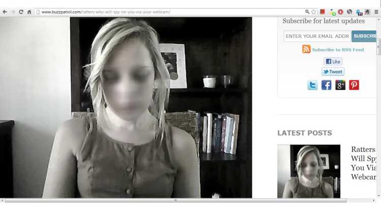 A young woman being watched on her webcam (scrnshot from buzzpatrol.com)