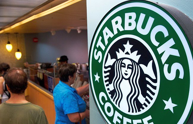Customers line up for coffee at a Starbucks inside Dulles Airport near Washington, August 2011. (Paul J. Richards/AFP/Getty Images)
