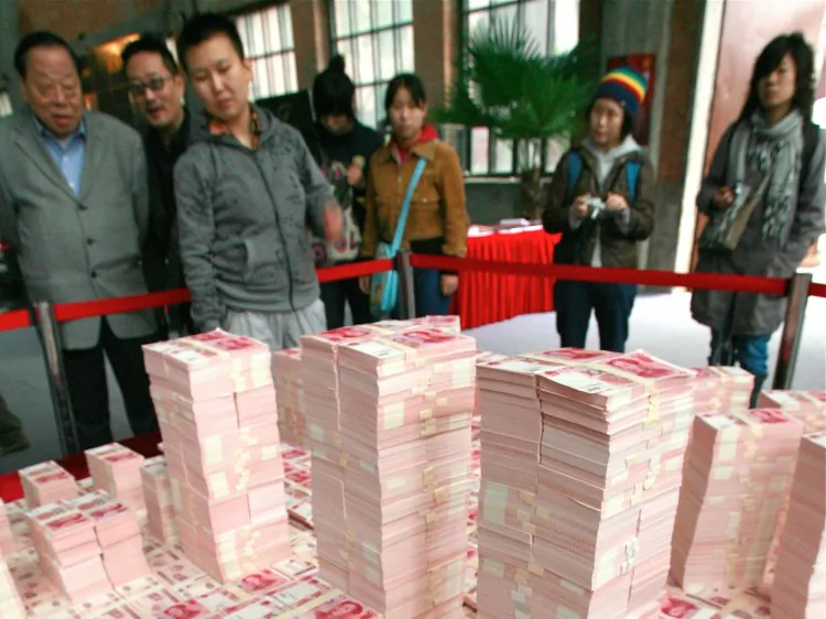 A model of Beijing's Central Business District made from Chinese yuan notes, in 2007. Economists say that rampant money printing is causing inflation in China. (Teh Eng Koon/AFP/Getty Images)