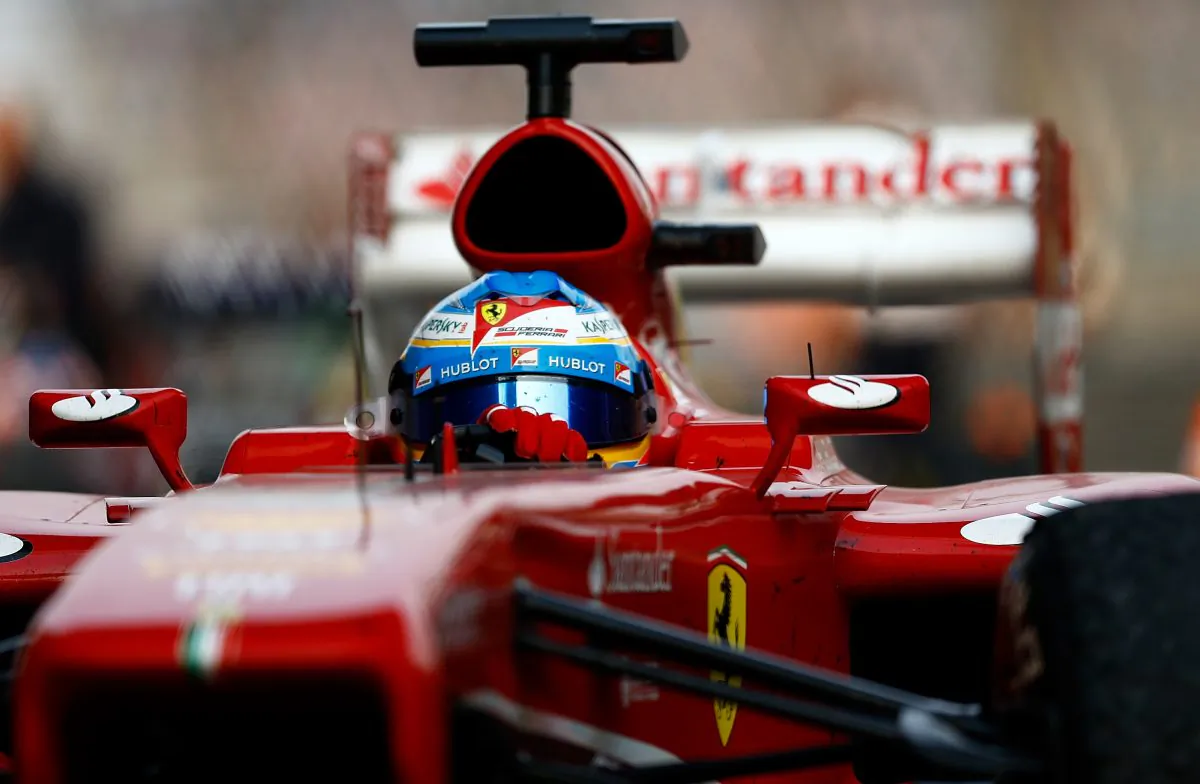 Fernando Alonso of Spain and Ferrari drives into parc ferme after winning the Chinese Formula One Grand Prix at the Shanghai International Circuit on April 14. (Vladimir Rys/Getty Images)