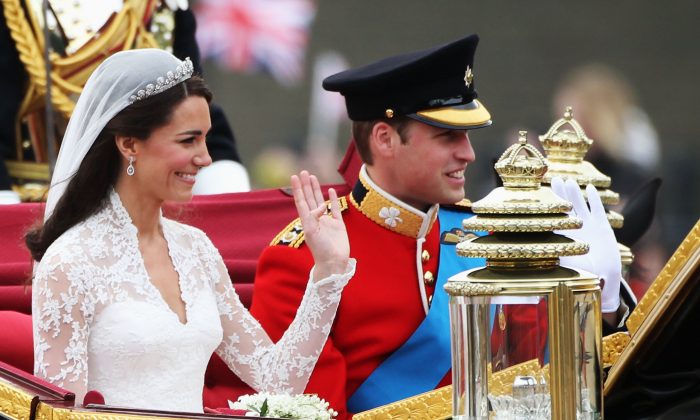  Their Royal Highnesses Prince William, Duke of Cambridge and Catherine, Duchess of Cambridge journey by carriage procession to Buckingham Palace following their marriage at Westminster Abbey on April 29, 2011 in London, England. (Warren Little/Getty Images)