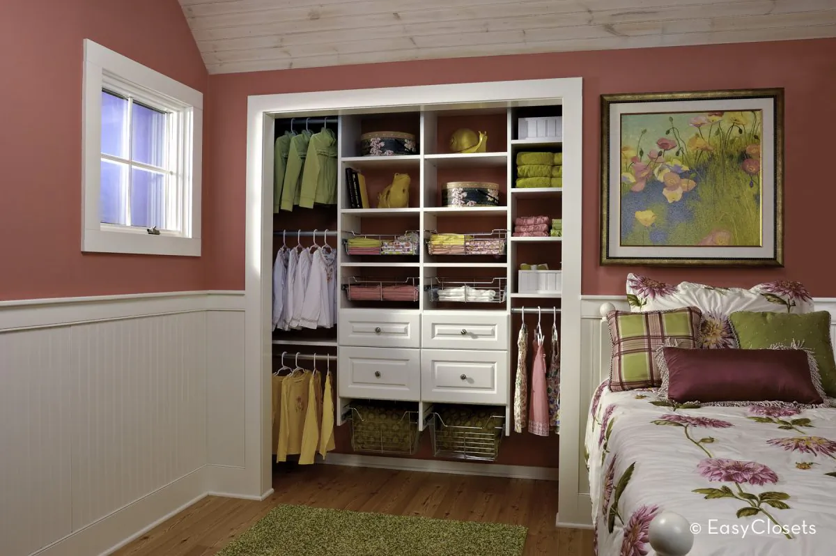 Closets with drawers and hangers low to the ground help kids stay organized.