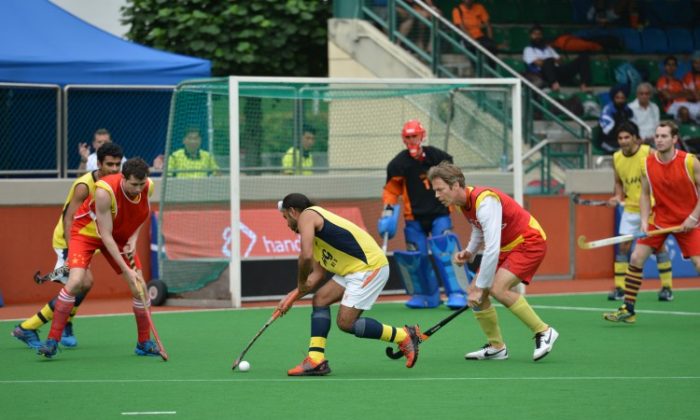 Cup Finalists Beijing Hockey Club and Jatt Airways play in a preliminary round at the HKFC Hockey 6's Easter Hockey Tournament. (Bill Cox/The Epoch Times)