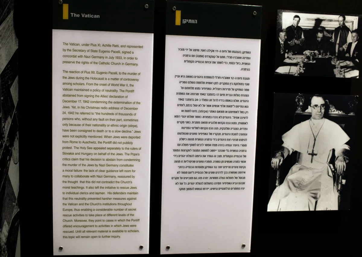 Photo of Pope Pius XII is seen next to a new text in Hebrew and English in the museum at the Yad Vashem Holocaust Memorial in Jerusalem June 1, 2012. (MENAHEM KAHANA/AFP/GettyImages)