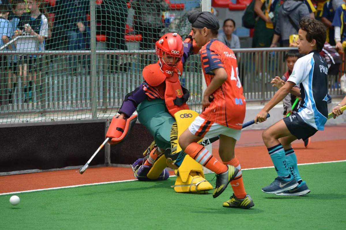 Khalsa’s U10 and U12 goalie makes a good save in this U12 Semi-final with HKFC. But HKFC progressed and won the Final against KCC. Khalsa did, however, win the U10 trophy. (Bill Cox/The Epoch Times)