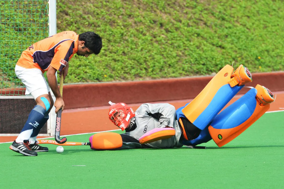 Another typical athletic performance by Tong Cheung the Elite-A goalkeeper in their Holland Cup match with SSSC-A on Sunday April 14. But SSSC-A were strong enough to win the match 4-0 and knock-out Elite from the tournament in the process. (Bill Cox/The Epoch Times)