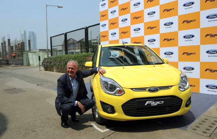 President and Managing Director of Ford India, Michael Boneham poses with the 'Figo' during its launch in Mumbai on Oct. 15, 2012. (PUNIT PARANJPE/AFP/Getty Images)