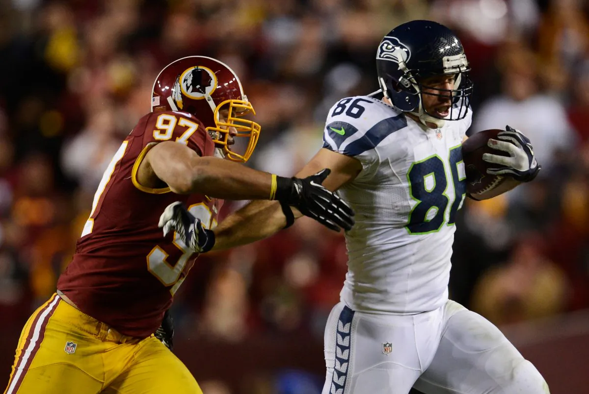 A Washington D.C. council member wants the Washington Redskins name changed to the Washington Redtails, or something similar. The Redskins name, as well as the logo (on the left) are discriminatory, says the council member. (Patrick McDermott/Getty Images)