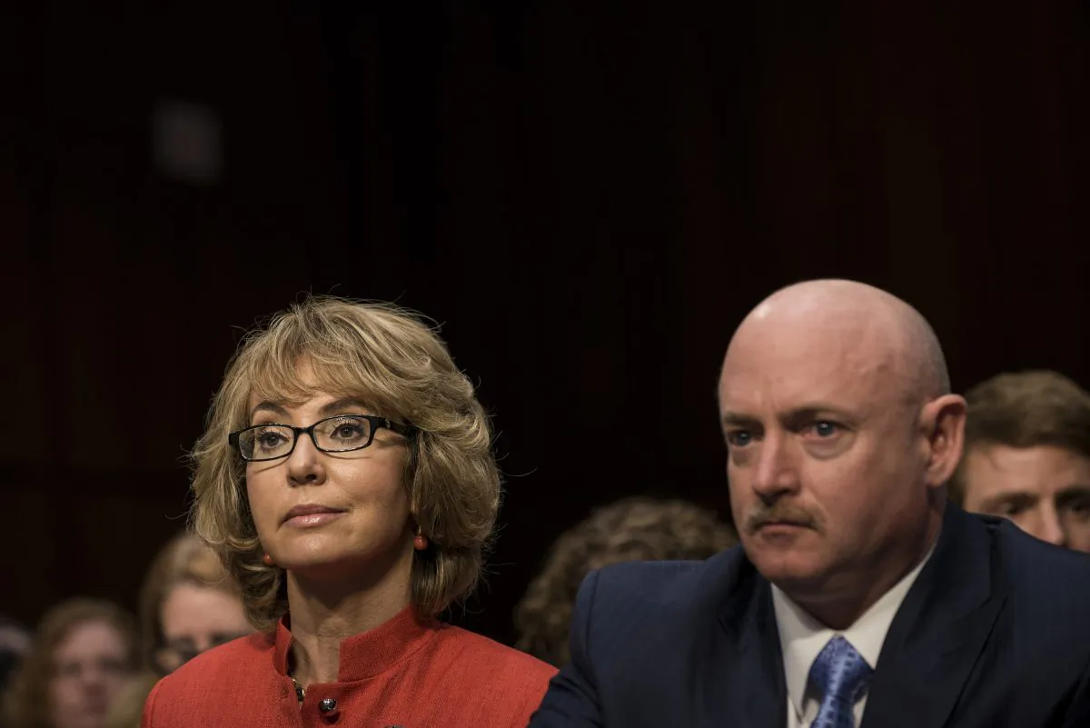 Former Arizona Rep. Gabrielle Giffords and her husband Retired Astronaut Mark Kelly wait to speak during a hearing of the Senate Judiciary Committee on Capitol Hill January 30, 2013 in Washington, DC.  (BRENDAN SMIALOWSKI/AFP/Getty Images)