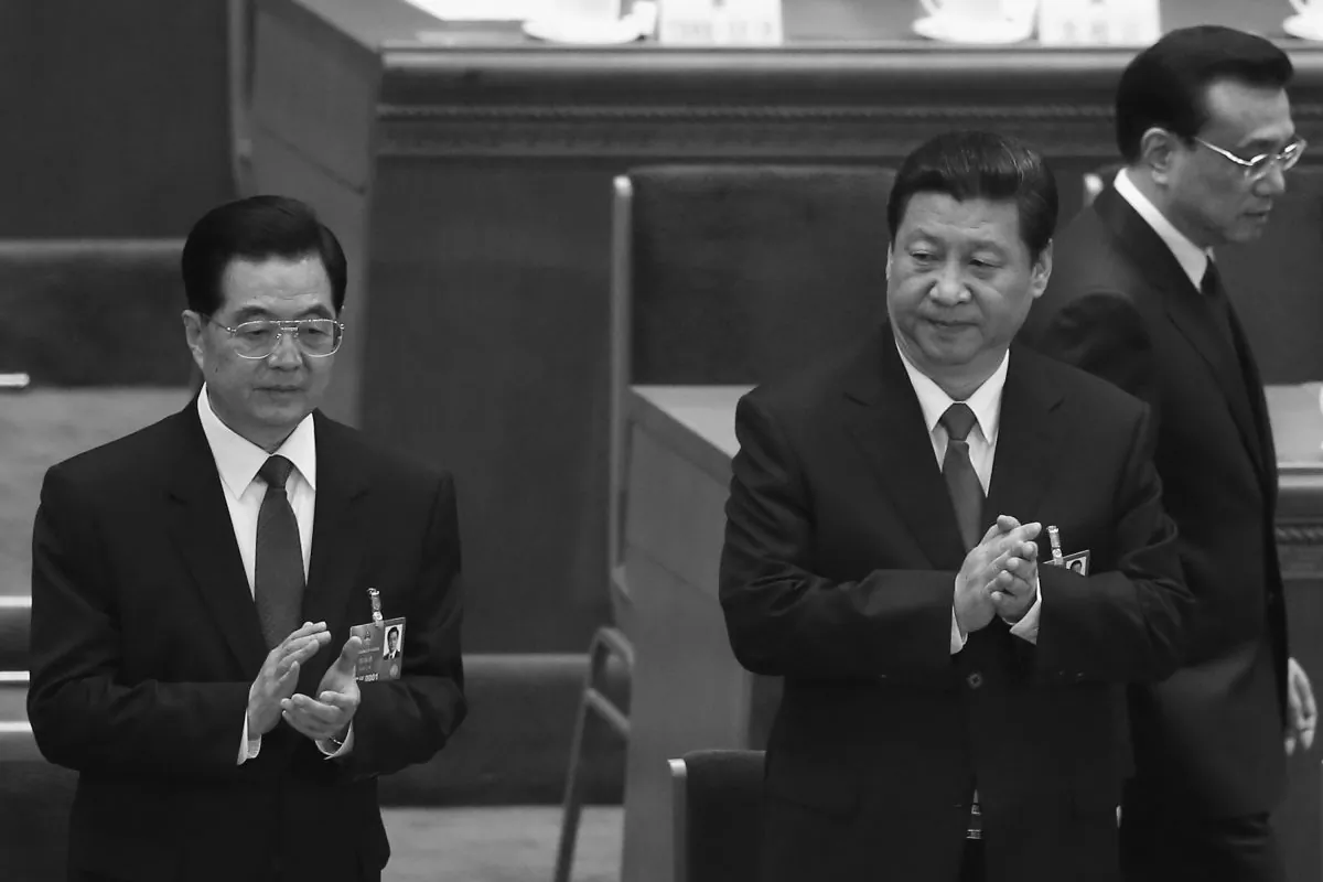 Chinese premier Li Keqiang (R) walks past former Party chief Hu Jintao (L) and the newly-elected leader Xi Jinping (C) at the closing session of the National People's Congress (NPC) in Beijing on March 17, 2013. Xi and Li are among the top officials being asked to disclose their assets as part of a new anti-corruption petition. (Feng Li/Getty Images) 