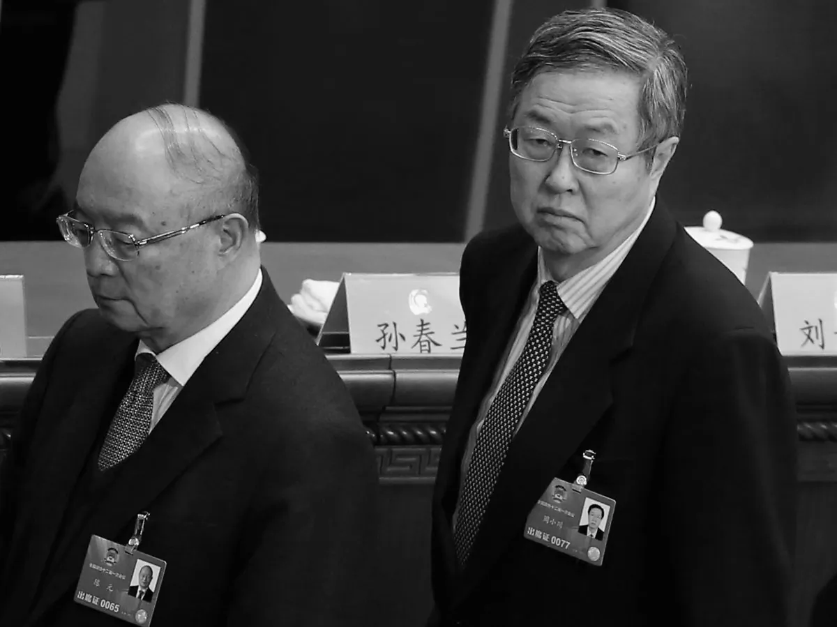 Ex-governor of China Development Bank Chen Yuan (L) and Zhou Xiaochuan (R), newly-appointed Vice chairman of the Chinese People's Political Consultative Conference (CPPCC), leave the closing session of the annual CPPCC in Beijing on March 12, 2013. There is speculation Chen has been transferred to another bank due to his undesirable ties with ousted Politburo member Bo Xilai. (Feng Li/Getty Images)