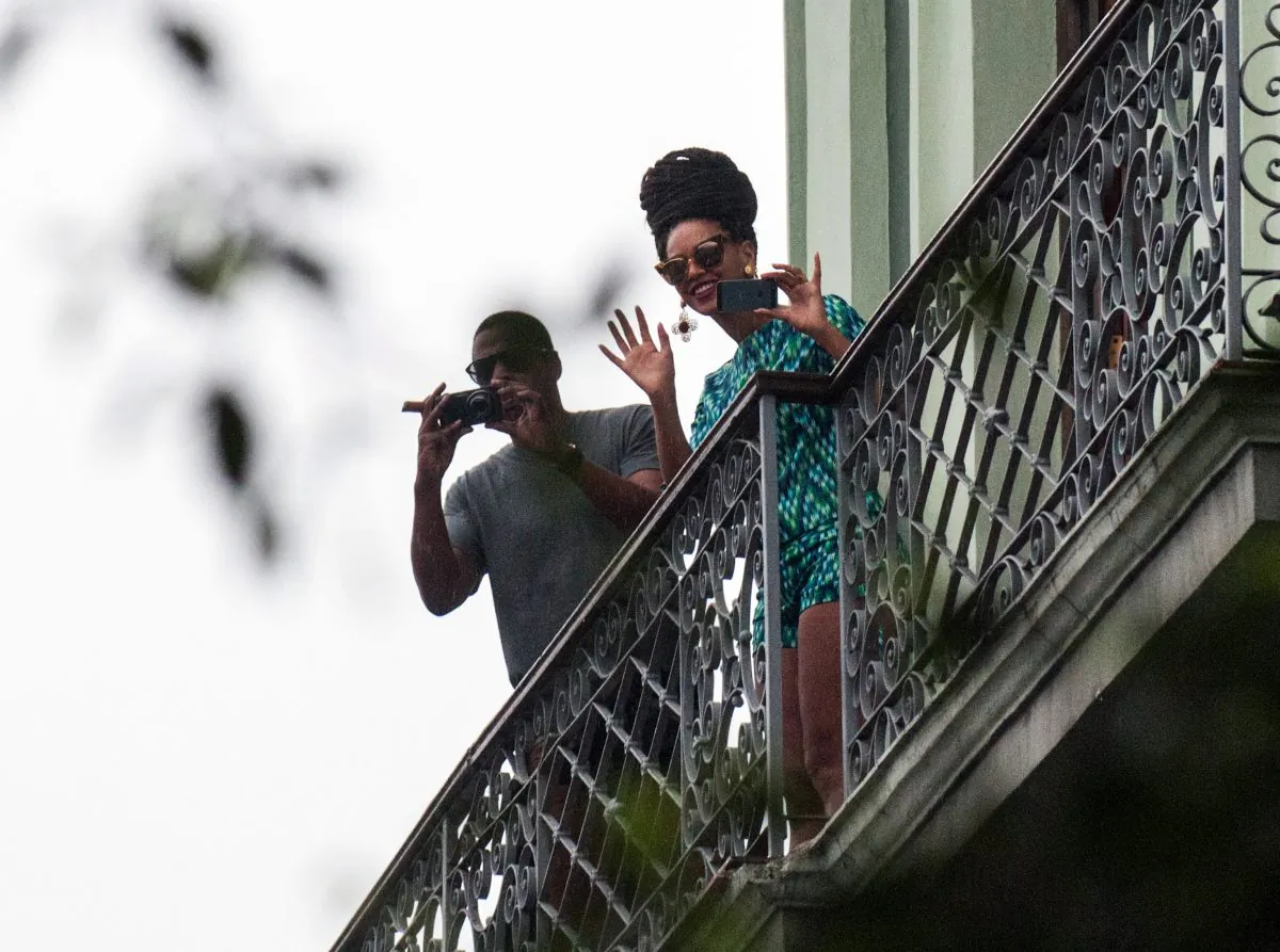 US singer Beyonce is seen in a balcony of the Saratoga Hotel in Havana next to her husband Jay Z, on April 5, 2013. (STR/AFP/Getty Images)