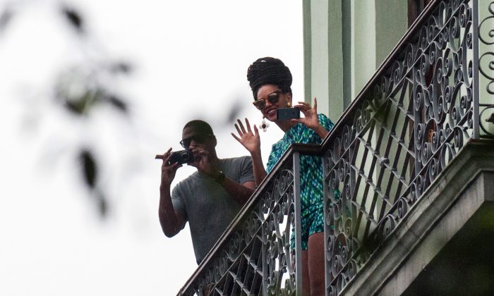 US singer Beyonce is seen in a balcony of the Saratoga Hotel in Havana next to her husband Jay Z, on April 5, 2013. (STR/AFP/Getty Images)