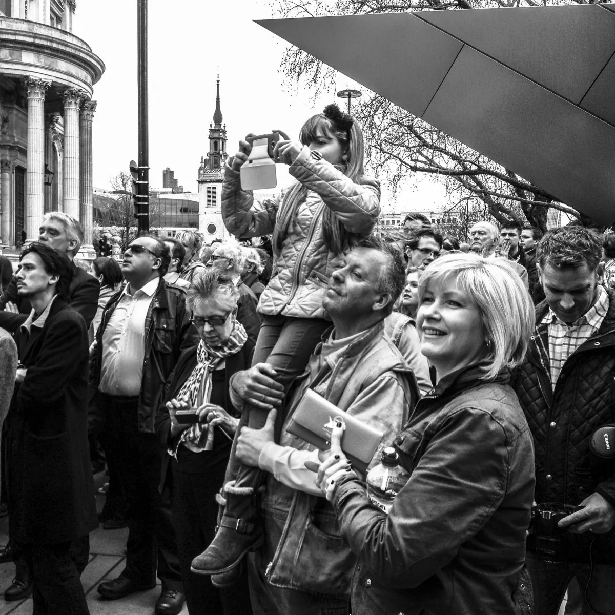  girl takes a photograph, as people gather to bid farewell to one of Britain's most influential and divisive prime ministers, Baroness Thatcher, at St. Paul's Cathedral in London, England on April 17, 2013. (Daniel Berehulak/Getty Images)