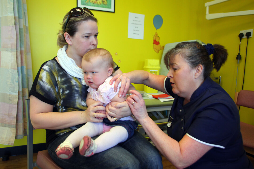 A 14-month-old receives the combined Measles Mumps and Rubella (MMR) vaccination at drop-in clinic  near Swansea in south Wales, as part of a vaccination drive.  (Geoff Caddick /AFP/Getty Images)