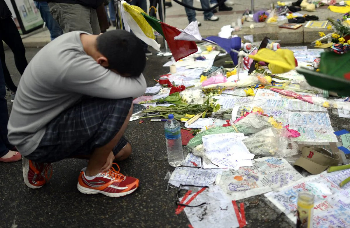 People visit a make-shift memorial on Boylston Street on April 20, 2013, near scene of Boston Marathon explosions. (Timothy A. Clary/AFP/Getty Images)